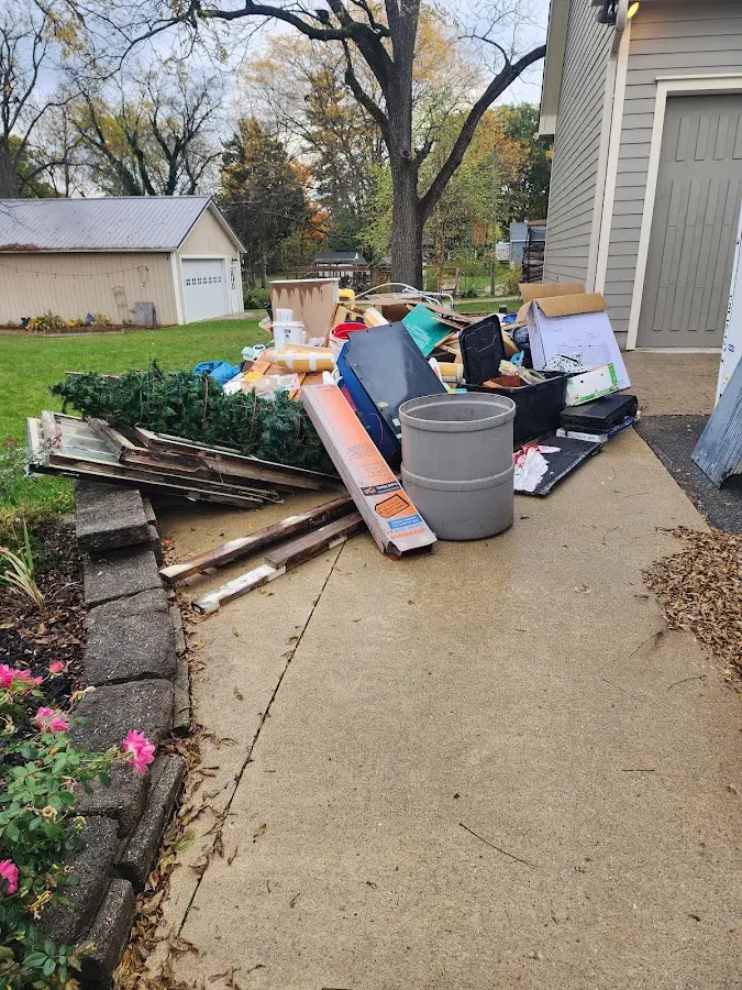 Dumpster being loaded with debris for Demolition Dumpster Rental in Sea Cliff
